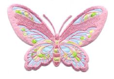 a pink butterfly with green and yellow details on it's wings, sitting on a white surface