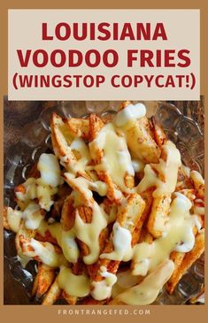 a glass bowl filled with cheese fries covered in sour kraut sauce and drizzled with the words, louisiana voodoo fries wingstop copycat