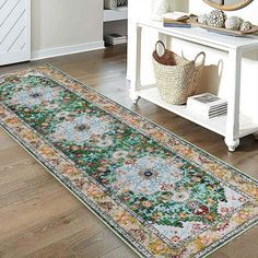 a large rug in the middle of a room with a mirror and vases on it