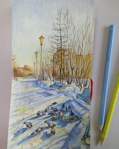 two pencils are next to a drawing of birds in the snow near a park bench