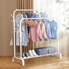 an ironing rack with clothes and shoes on it