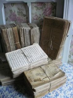 several old books stacked on top of each other