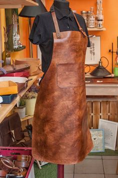 a leather apron is on display in a shop