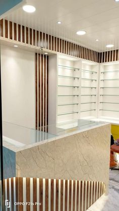 the interior of a store with marble counter tops and wooden slats on the wall