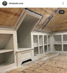 an unfinished room with white cabinets and plywood on the ceiling that is being installed