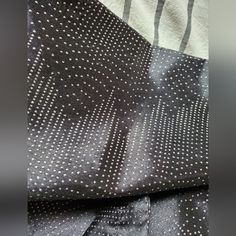 the black and white polka dot fabric is folded up