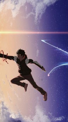 a man flying through the air while holding onto an object in front of a star filled sky