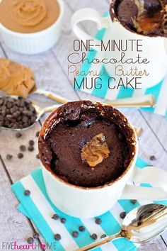 one - minute chocolate peanut mug cake in a white cup on a blue and white napkin