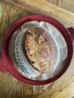 a loaf of bread sitting on top of a red plate