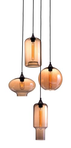 three glass pendant lights hanging from a ceiling