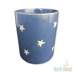 a blue cup with white stars on it