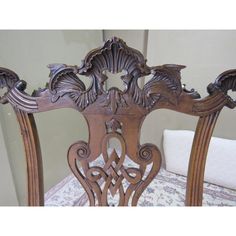 an antique wooden bed frame with intricate carvings