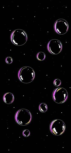 an image of soap bubbles floating in the air on a black background with space for text