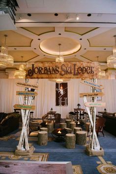 the entrance to jordan's st louis lodge is decorated with wood logs and signs