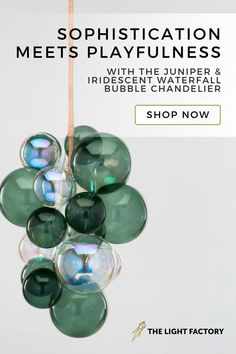 a bunch of green glass balls hanging from a string with the words, sophisication