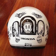 a white helmet with an image of a woman inside it