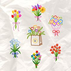 a bunch of flowers that are on a piece of paper