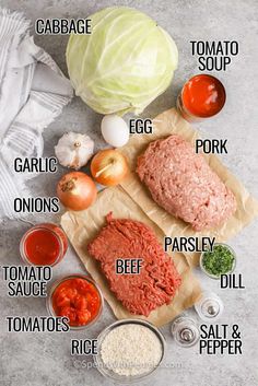 the ingredients needed to make this meatloaf recipe are laid out on parchment paper