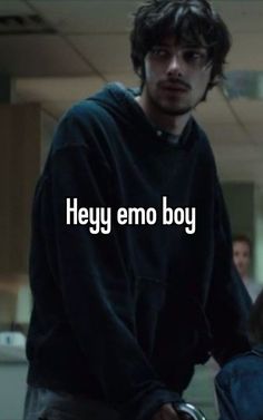 a man standing next to a woman with the words hey emo boy on it