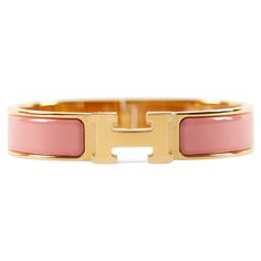 Hermès Clic H PM Bracelet in Papaye and Gold Wrist size: 16.8 cm Width: 12 mm Made in France Fake Hermes Bracelet, Hermes Bracelet Pink, Click H Bracelet Hermes, Hermes Gold Bracelet, Hermes H Bracelet, Hermes Kelly Bracelet Gold Metal, Bracelet Hermes, H Bracelet, Modern Bracelets