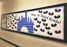 a bulletin board that says year in third grade with mickey mouse and castle on it