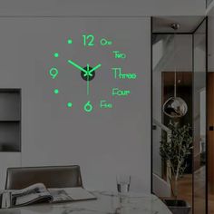 a wall clock with green numbers on it in the middle of a dining room table