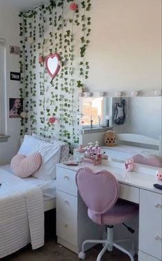 a bedroom with two beds and a desk in front of a window that has ivy growing on the wall