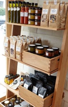 the shelves are filled with spices and condiments