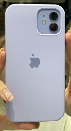 a person holding an iphone in their hand with the back cover up to show it's camera