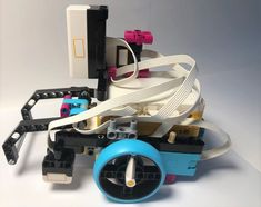 an image of a robot that is made out of legos and parts on white background