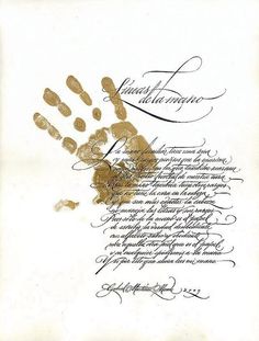 an old hand print with gold ink on white paper and black writing in cursive handwriting