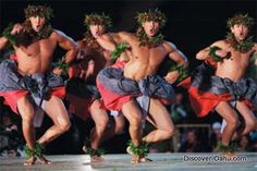 men in hula skirts dancing on stage