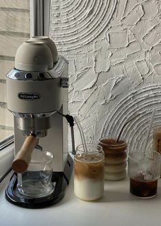 an espresso machine sitting on top of a counter