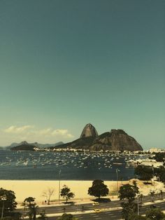 an aerial view of the beach and mountains