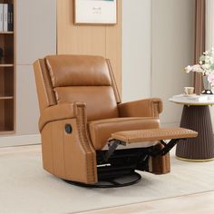 a brown recliner chair sitting on top of a white rug next to a table