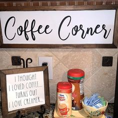 a sign that says coffee corner on the side of a kitchen counter next to other items