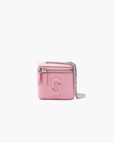 Only the essentials matter with this crossbody Mini Vanity Bag. This elegantly compact evening essential features a two-way zip-around closure, an internal lipstick holder and our signature covered J Marc seal. Featuring an elevated chain strap, style as a shoulder bag or wear as a crossbody for effortless, lightweight travel. Perfect for stashing keys, lipstick, cash and cards. | MARC JACOBS The Mini Vanity Bag in Ribbon Pink Marc Jacobs Mini Bag, Mini Vanity, Pink Vanity, Vanity Bag, Lipstick Holder, Marc Jacobs Bag, Mini Crossbody, Pink Bag, Chain Strap