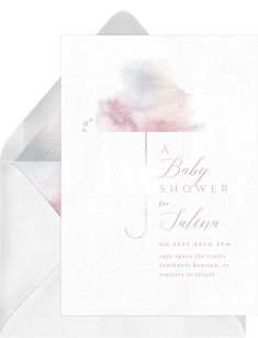 a baby shower is shown on the inside of an envelope with pink watercolors