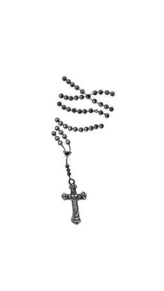 a black and white photo of a rosary with a cross hanging from it's end