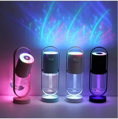 three different types of lights on display in front of a white wall with blue and pink lighting