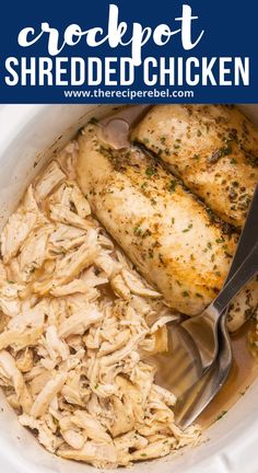 crockpot shredded chicken in a white bowl with spoons