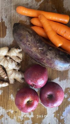 carrots, potatoes and other vegetables on a wooden surface