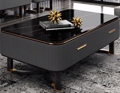 a black and gold coffee table sitting on top of a marble floor