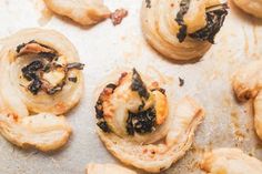 some food that is sitting on top of a baking sheet and has been cut in half