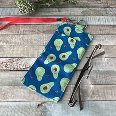 Avocado glasses holder, these fabric lanyard glass holders are ideal for anyone that wears a lanyard and needs to keep their glasses closeby, especially if you don't have pockets! They're also ideal for clipping to bags and cases or for notebooks diaries and journals. They make a good teacher gift idea for end of term and of course, idea for avocado lovers. You can fit glasses in (and sometimes a pen too depending on the size of your glasses) and there is a split ring to use to clip to your neck Mexican Avocado, Glasses Fit, Fabric Lanyard, Pocket Clip, Glass Holders, Best Teacher, Badge Holders Lanyard, Lanyard, Gift For Lover