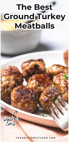 the best ground turkey meatballs on a plate with a fork