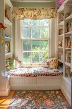 a window seat in the corner of a room with bookshelves on either side