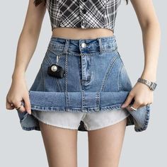 Introducing our 2023 Summer Collection's Flare Above-the-knee Denim Skirt that fuses the Y2K style with trendy fashion! Filled with nostalgia and youthful energy. this high-waisted shorts-skirt will make you the talk of the town!Why You'll Fall In LoveThis skort is a creative ode to the much-loved Y2K fashion era. patterned to make sure you stand out and turn heads. From its unique pieced-together design to its attention-grabbing high-waist silhouette. every detail is crafted to perfection.Unmis Spring Denim Skort With Built-in Shorts, Denim Skort With Built-in Shorts For Spring, High Rise Y2k Skort, Denim Mini Skirt With Built-in Shorts, Y2k Short Denim Skirt With Pockets, Denim Y2k Mini Bottoms, Y2k Style Mid-rise Mini Skirt For Spring, High Rise Denim Blue Y2k Mini Skirt, Y2k High-rise Denim Blue Mini Skirt