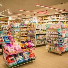 the inside of a toy store filled with toys