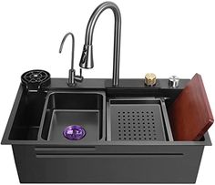 an image of a kitchen sink that has two sinks and a faucet in it